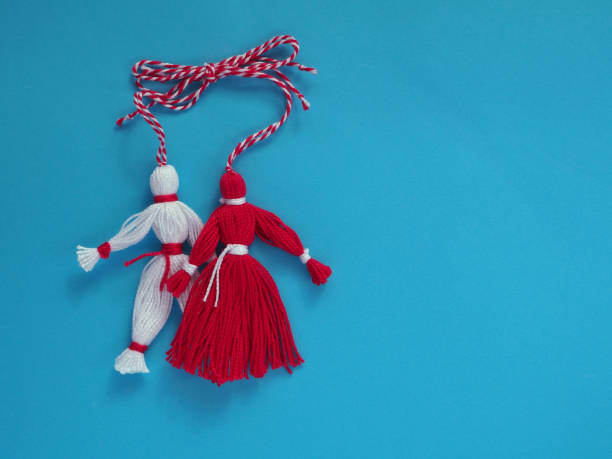 istock Martisor red and white thread dolls on a blue background. 1460509745
