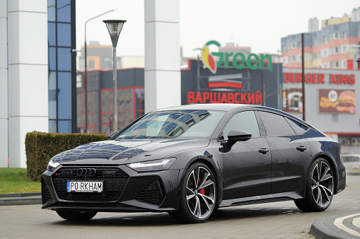 Belarus, Minsk - 24.01.2023:Audi RS 7 Sportback premium black car stands on the street in the city. Audi RS7 Sportback.