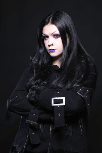 Goth lady of 30 photographed in a studio.
