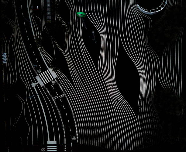 Drone images of  Superkilen in the Nørrebro district of Copenhagen. Commuters ride their bicycles on the bike lanes and pedestrians walk across the intriguing black and white patterns or red colours of the park. This popular park is situated in the epicenter of one of Denmarks most ethnical-diverse and socially challenged areas , and is designed as a meeting place to bring together locals. Besides sporting a family friendly playground and a hangout for chess players, athletes etc., it is a well visited tourist attraction.