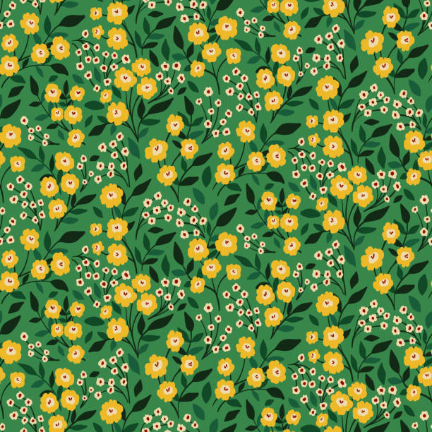 Seamless floral pattern with small yellow flowers, leaves in a liberty ornate arrangement on a green background. Vector. Seamless floral pattern, liberty ditsy print with tiny hand drawn plants. Cute botanical design with small yellow flowers, leaves, twigs on a green background. Vector illustration. mustard yellow fabric stock illustrations