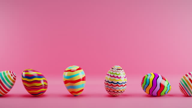 Multicolored Easter eggs rolling on a red background. Loop animation