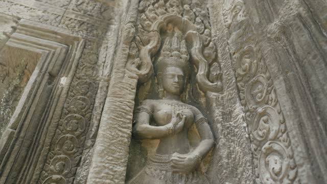 Ta Prohm Temple Bayon Style in Angkor Archeological Park - Close Up Detail Relief Wall and Scupture