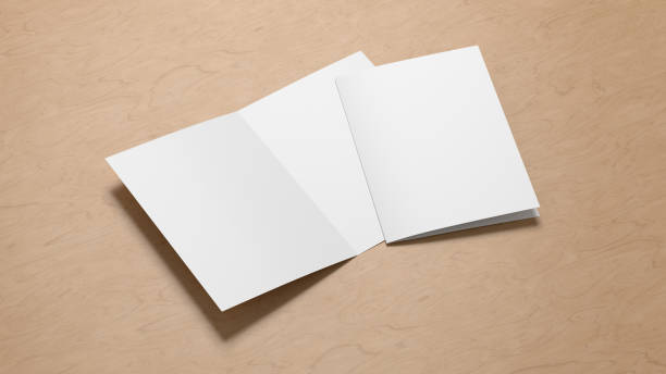istock Half-folded flyer A4 booklet mock up on wooden background 1460519920