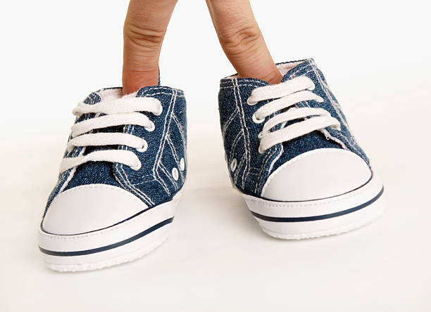 istock shoes and fingers 146052165