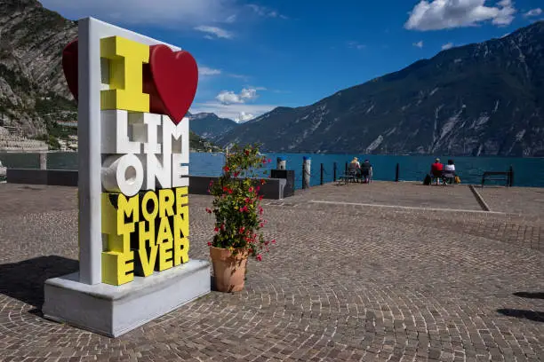 Limone sign at the boulevard of Limone sul Garda. A historic town on the western shore of lake Garda, Northern Italy.