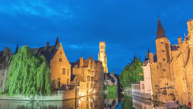 Bruges Belgium time lapse 4K, city skyline night timelapse at Rozenhoedkaai Dijver Canal with Belfry Tower