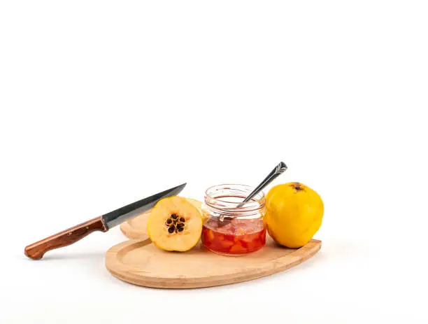 Photo of Fresh ripe quince and jam on white background isolated.