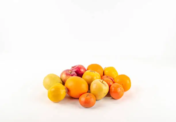 Photo of Fresh ripe mandarin orange apple quince  on white background isolated.