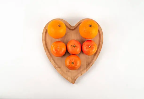 Photo of Fresh orange mandarin tangerine for diet raw uncooked healthy tasty
