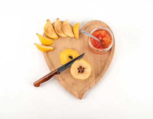 Photo of Fresh ripe quince and jam on white background isolated.