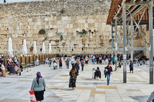 asian muslim woman walking on pedestrian in  the old Jerusalem