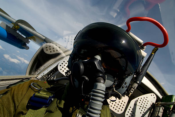 Pilot A pilot in his aircraft air force stock pictures, royalty-free photos & images