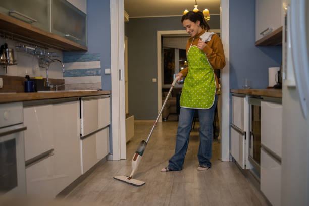 istock Woman vacuuming dust 1460528192