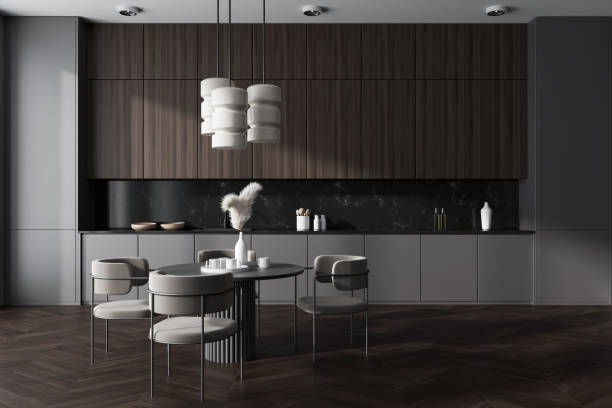 istock Grey kitchen interior with seats and eating table, shelves and kitchenware 1460528578