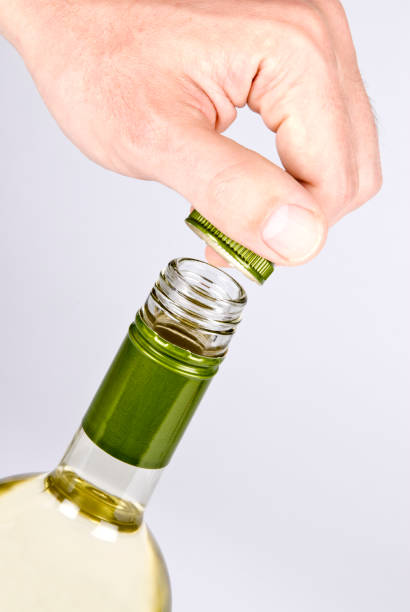 istock Opening A Bottle of Wihte Wine with Screwcap 146052942