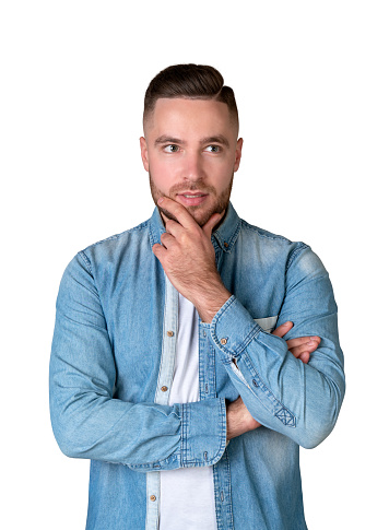 Handsome young man trying to problem-solve while isolated on white