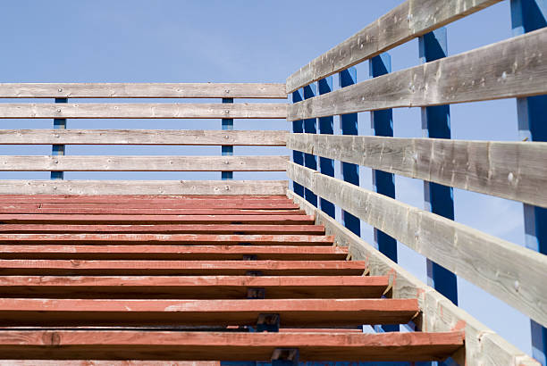School Bleachers A set of wooden bleaches shot from at the bottom wooden bleachers stock pictures, royalty-free photos & images