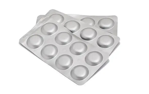 antibiotic pills in a gray blister pack, isolated on white