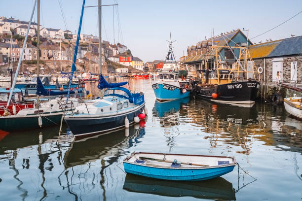 Cornwall, UK - October 12, 2008. Fishing boats and sailing yachts moored in Mevagissey harbour, Cornwall, UK