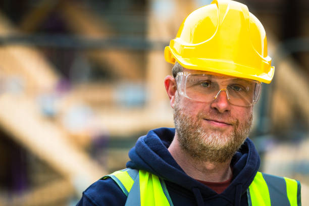 istock Portrait of construction worker in protective workwear on building site 1460533488