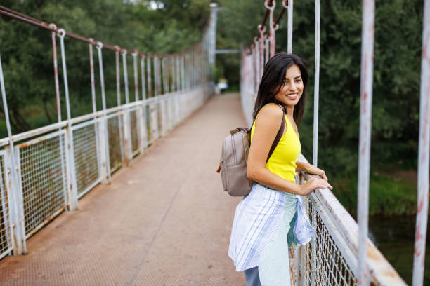 Free Stock Photo of Woman Standing on Bridge With Trees in Background ...