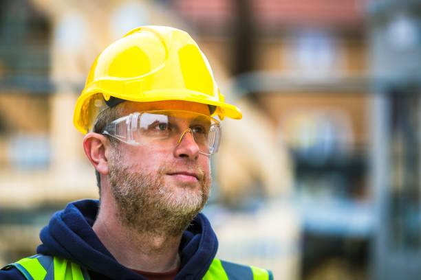 istock Portrait of construction worker in protective workwear on building site 1460537583