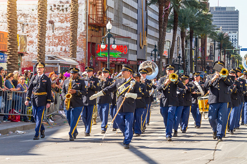 New Orleans, Louisiana, USA United States of America - Feb 28, 2022: Us Army Musicians during the parade along Canal street on Mardi Gras Day.\n\nMardi Gras' celebrations are concentrated for about two weeks before and through Shrove Tuesday, the day before Ash Wednesday (the start of lent in the Western Christian tradition).