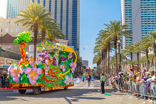 San Antonio, Texas, USA - April 8, 2022: The Battle of the Flowers Parade, People with a large turtle balloon promoting the Methodist Childrens Hospital