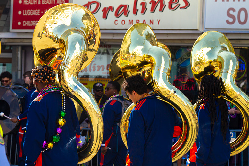 New Orleans, Louisiana, USA United States of America - Feb 28, 2022: A group of musicians during the parade along Canal street on Mardi Gras Day.\n\nMardi Gras' celebrations are concentrated for about two weeks before and through Shrove Tuesday, the day before Ash Wednesday (the start of lent in the Western Christian tradition).