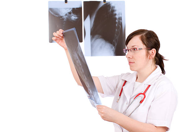 istock young female doctor isolated on white with x-ray 146053984