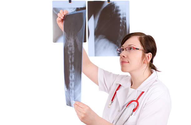 istock female doctor isolated on white with 3 x-ray 146053995