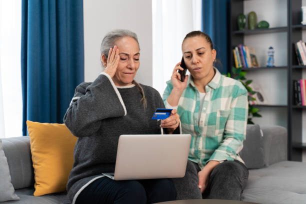 istock Senior woman realizes she was scammed while shopping online 1460542944