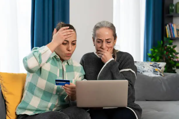 Photo of Two women realize they have been scammed while shopping online