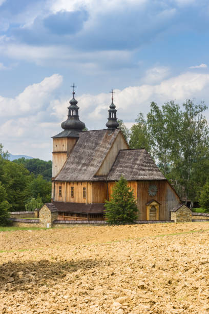 historic wooden church in the park in nowy sacz - nowy sacz imagens e fotografias de stock