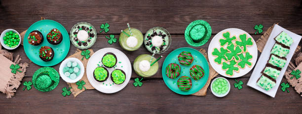 istock St Patricks Day dessert table scene over dark wood banner 1460544942