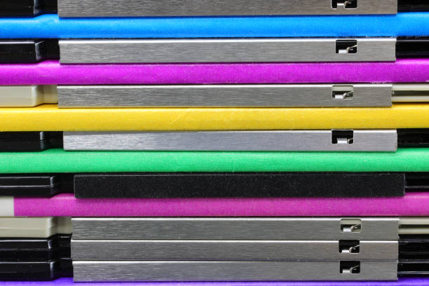 background of old floppy disks used to save data from early personal computers