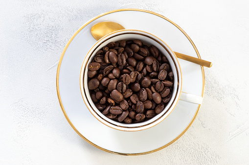 drink, beverage, coffee beans in a porcelain cup, close-up, top view