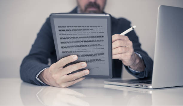 Rearview shot of a businessman holding his digital tablet