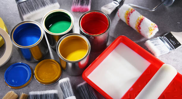 istock Paintbrushes of different size and paint cans 1460550757