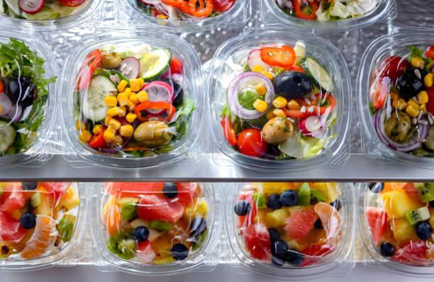 istock Boxes with pre-packaged vegetable salads in a commercial fridge 1460552238