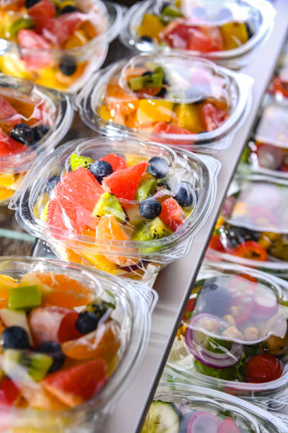 istock Boxes with pre-packaged fruit salads in a commercial fridge 1460552330