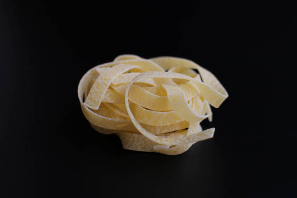 istock Dried Fettuccine in a Black  Background 1460552749