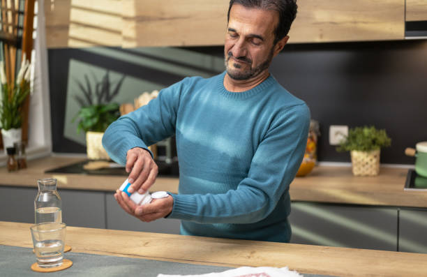 Senior Male Taking Pills stock photo