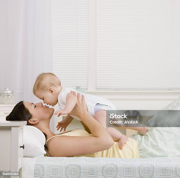 Mother Playing With Small Baby Stock Photo - Download Image Now - 30-39 Years, Adult, Baby - Human Age