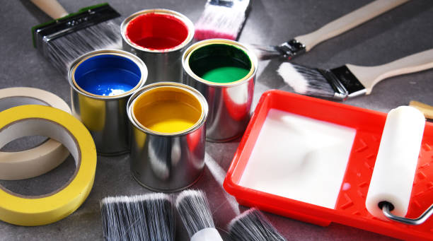 istock Paintbrushes of different size and paint cans 1460554034