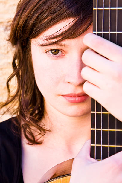 istock Woman behind guitar fretboard 146055445