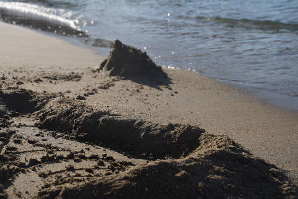 istock Holiday concept with sandcastle on the seaside 1460555129