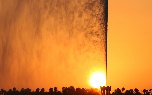 Colorful jet of water at sunset. Jeddah. Saudi Arabia