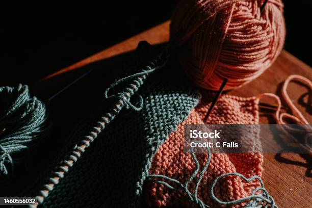 Closeup Of Two Balls Of Yarn Beside Knitting Stock Photo - Download Image Now - Knitting, Sewing Needle, Weaving